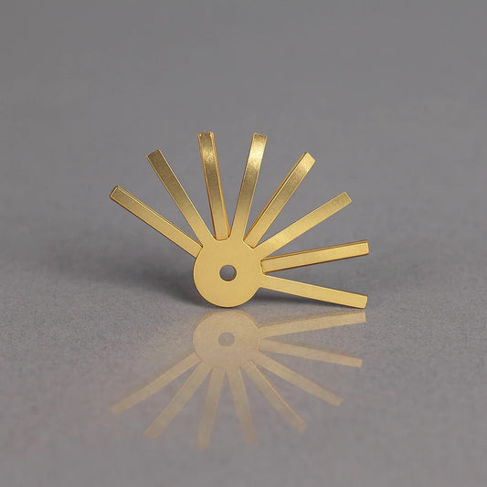 Gold metal tool on a gray background