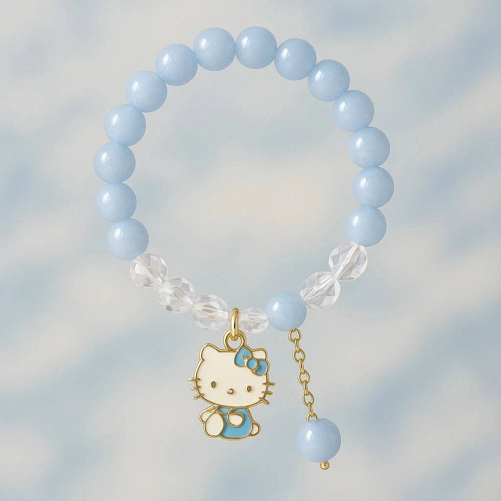 Blue beaded bracelet with a Hello Kitty charm on a light blue background