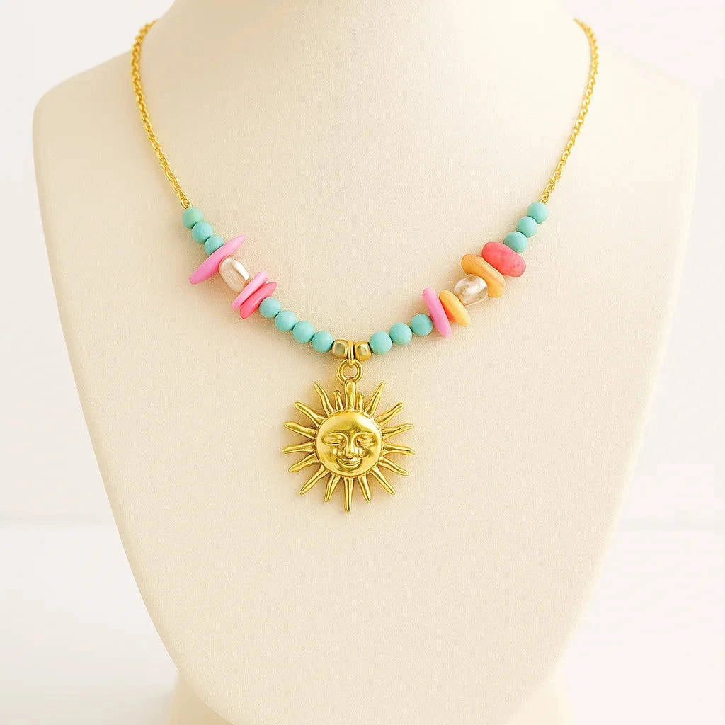 Necklace with colorful beads and a sun pendant on a mannequin bust.