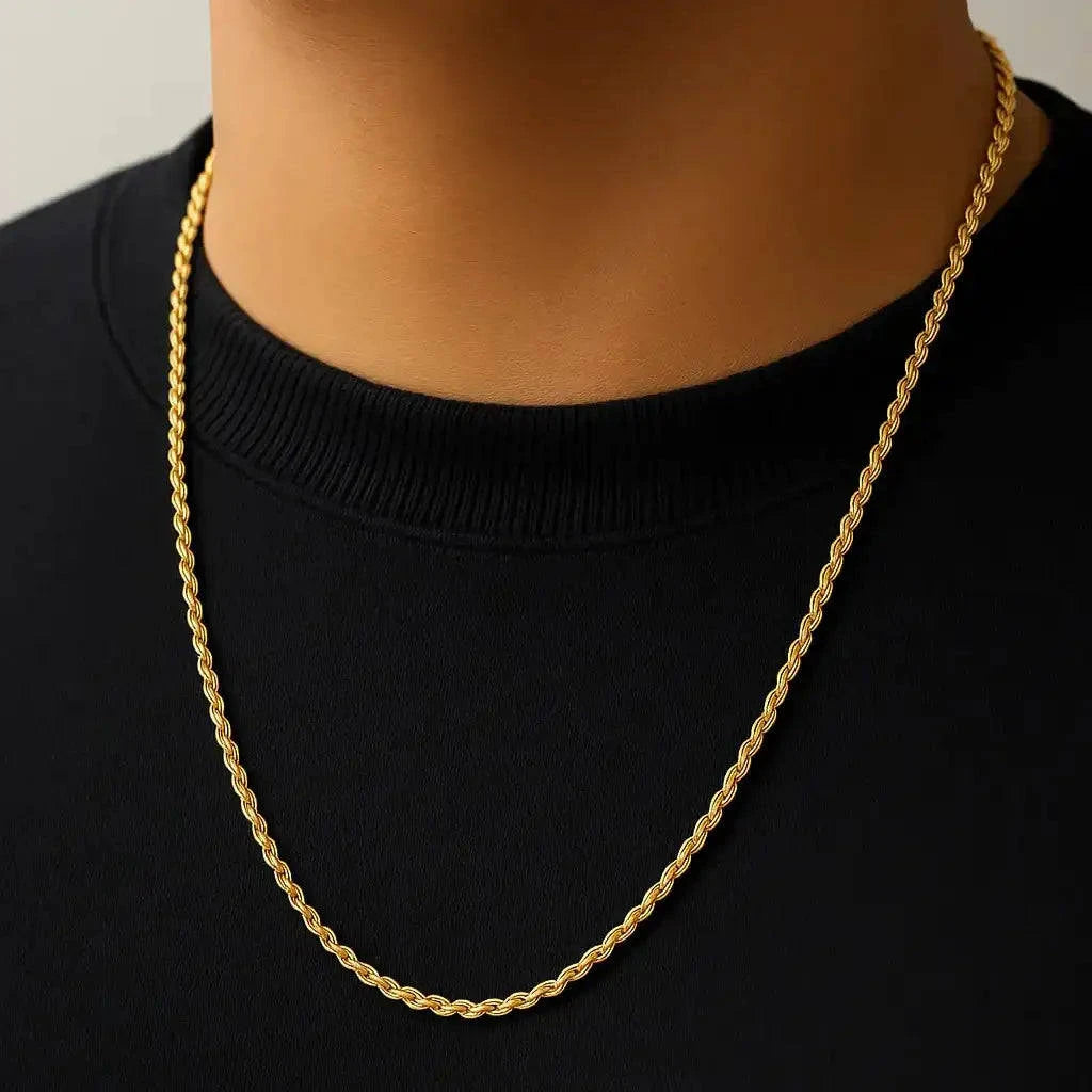 Gold chain necklace on a black shirt