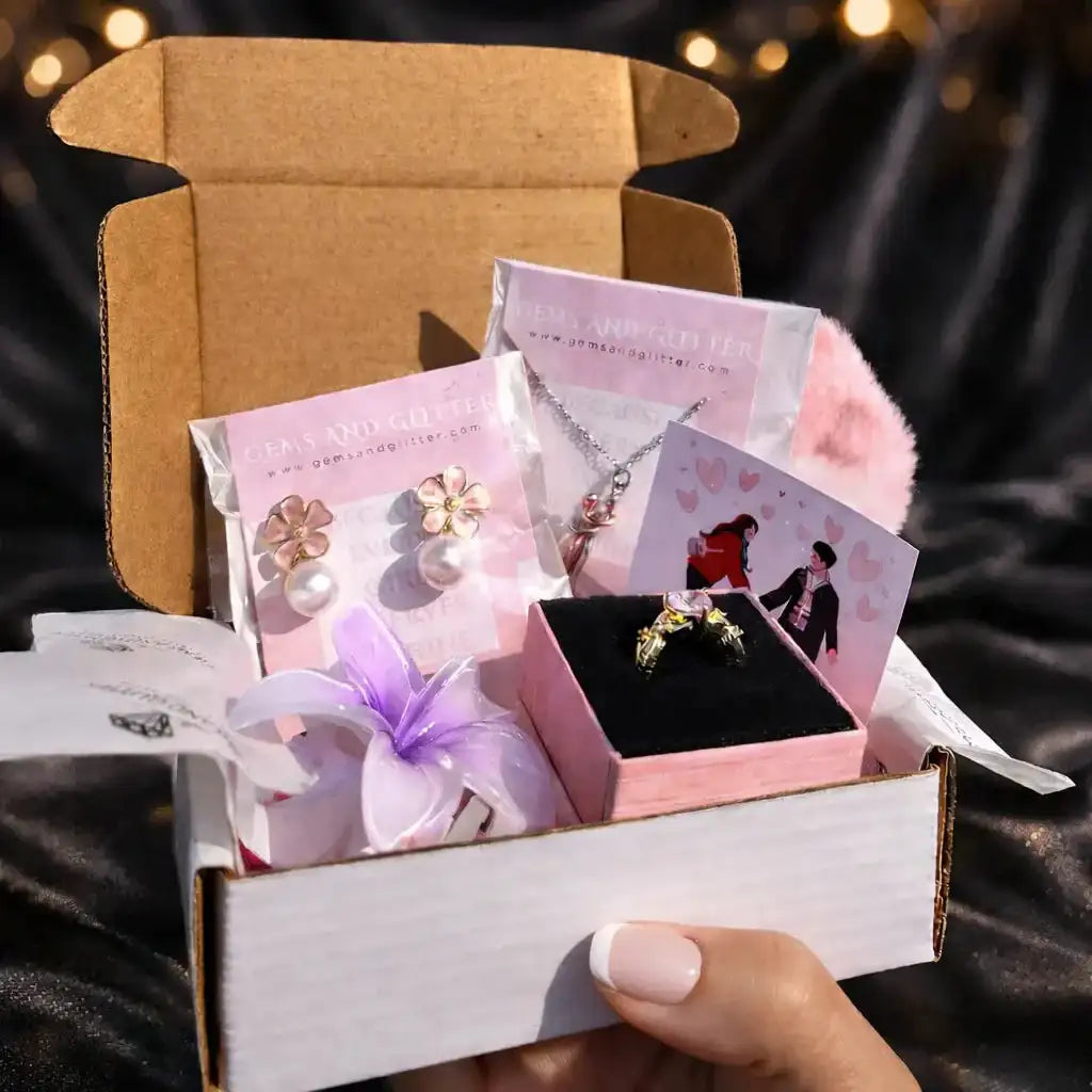 Open jewelry box with a ring and cards on a dark fabric background