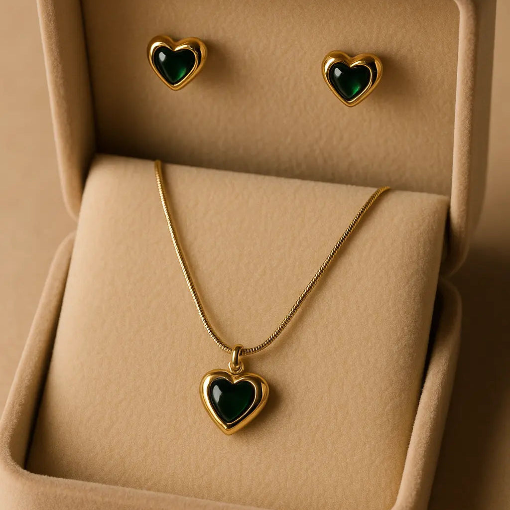Jewelry set with heart-shaped pendant and earrings in a beige display box.