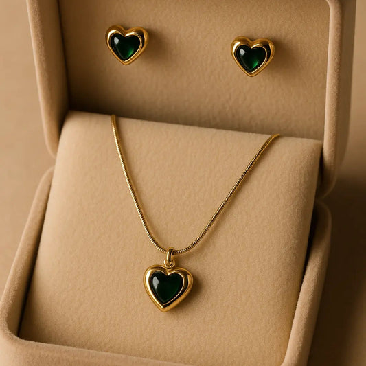 Jewelry set with heart-shaped pendant and earrings in a beige display box.