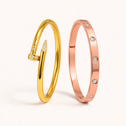 Gold and rose gold bangles with small diamonds on a white background