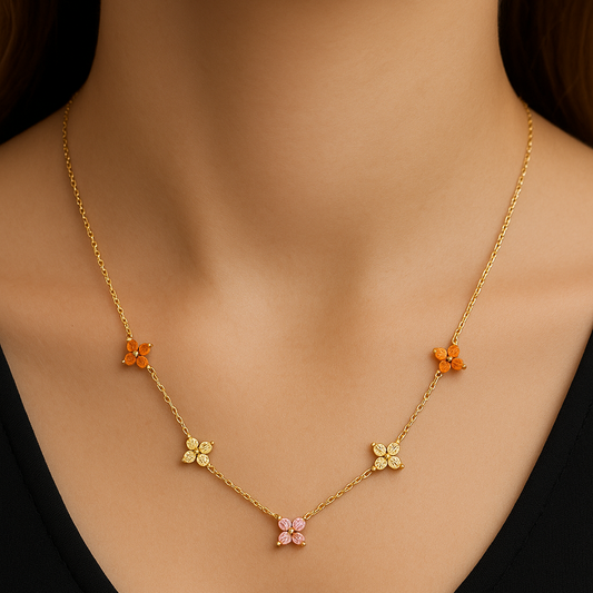 Gold necklace with floral pendants on a mannequin