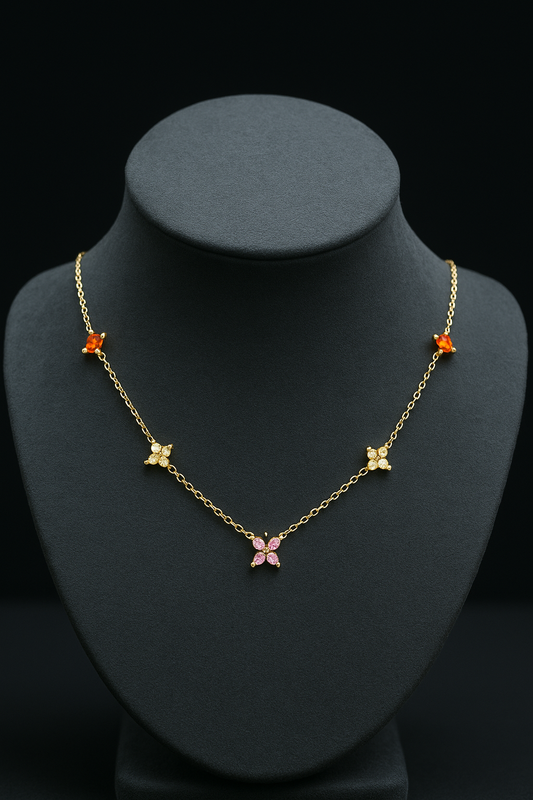 Gold necklace with butterfly pendants on a black mannequin bust