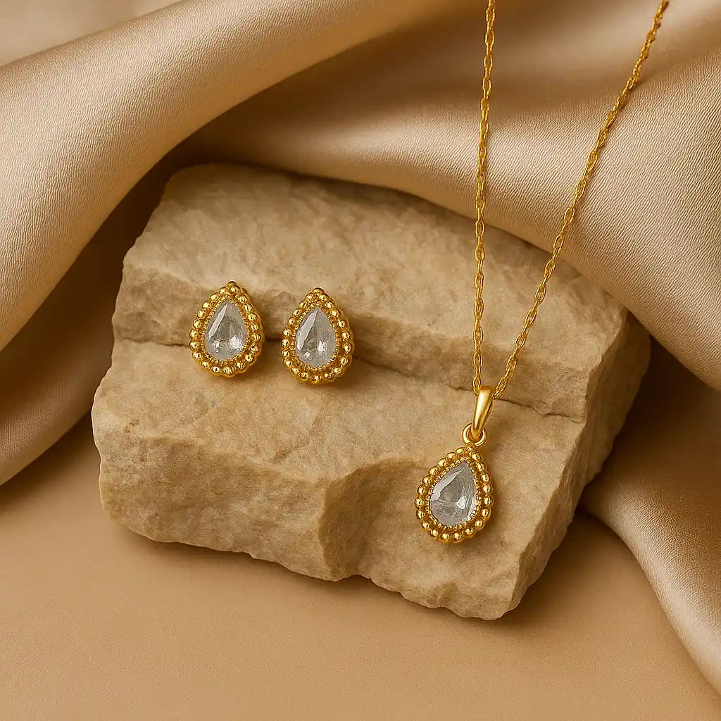 Anti-tarnish gold teardrop pendant set with earrings in jewelry box
