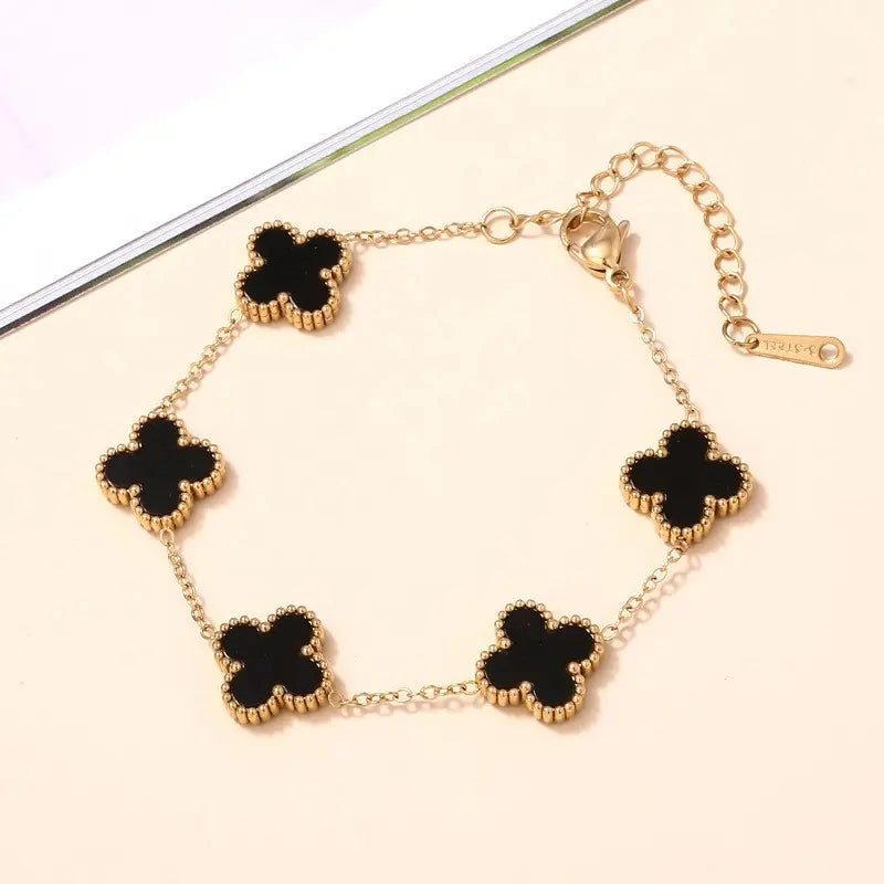 Anti-Tarnish Black Clover Gold Jewelry Set with matching necklace, bracelet, earrings, and ring