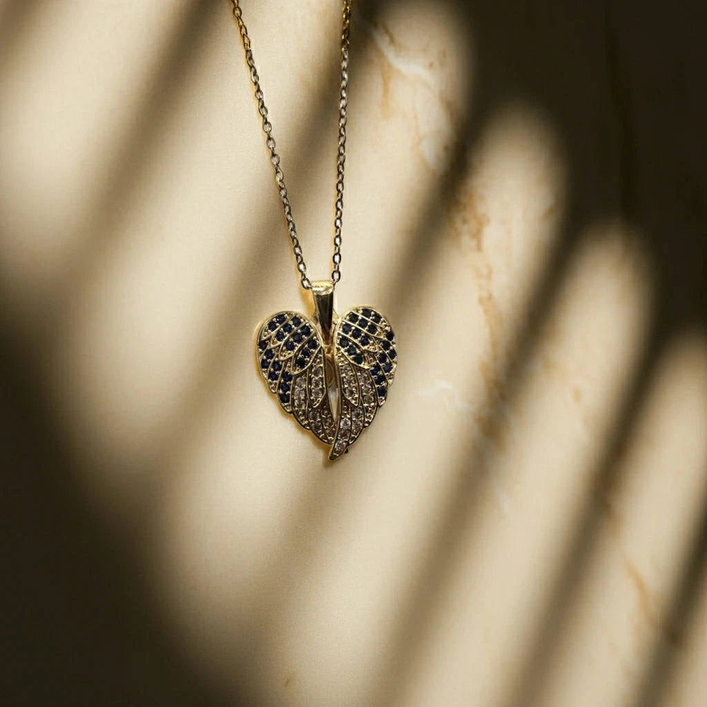 Heart-shaped pendant necklace with intricate design on a marble surface