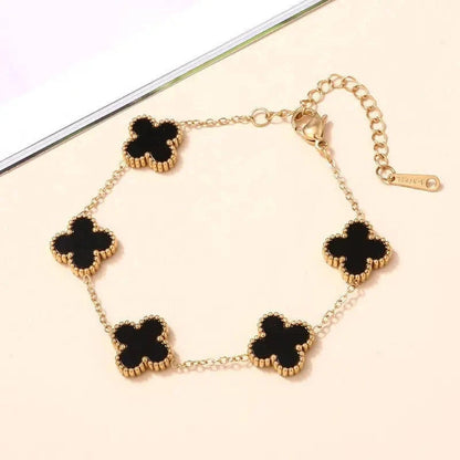 Anti-Tarnish Black Clover Gold Jewelry Set with matching necklace, bracelet, earrings, and ring