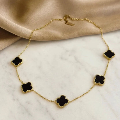 Anti-Tarnish Black Clover Gold Jewelry Set with matching necklace, bracelet, earrings, and ring