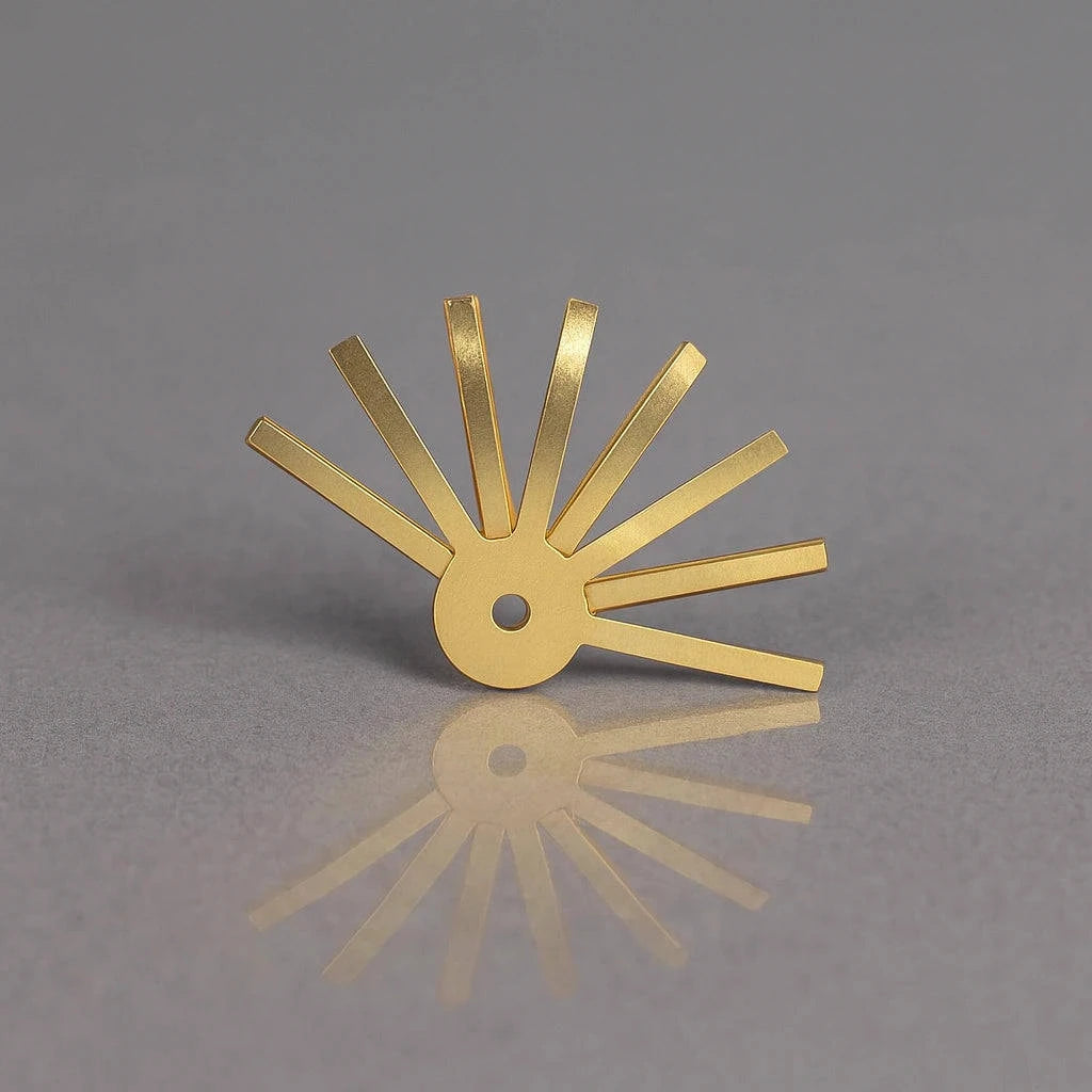 Gold metal tool on a gray background