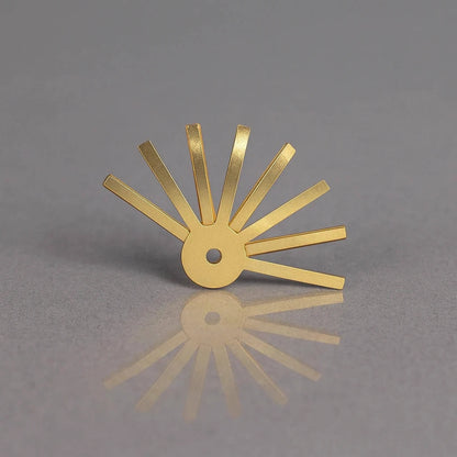 Gold metal tool on a gray background