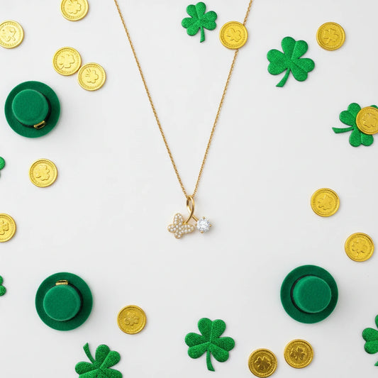 Gold necklace with a pendant on a white background with green clovers and gold coins.